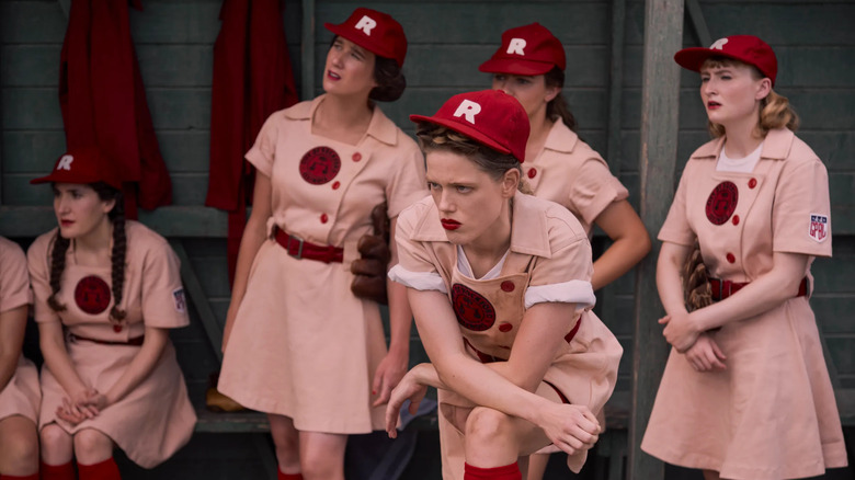 The Rockford Peaches baseball team waits in the dugout on A League of Their Own TV show
