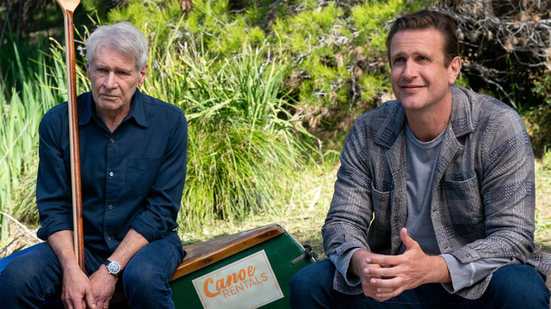 Harrison Ford and Jason Segel as Paul and Jimmy, sitting on a canoe on Shrinking