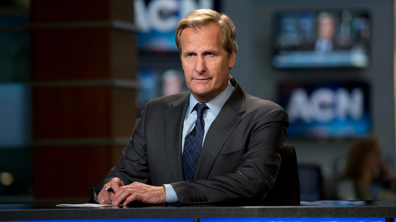 Jeff Daniels as Will McAvoy, sitting behind a news desk at ACN on Newsroom