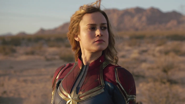Brie Larson as Carol Danvers wearing her Captain Marvel suit in the desert in Captain Marvel