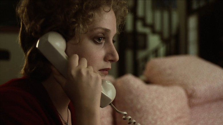 Carol Kane as Jill with chorded phone to her ear in When a Stranger Calls