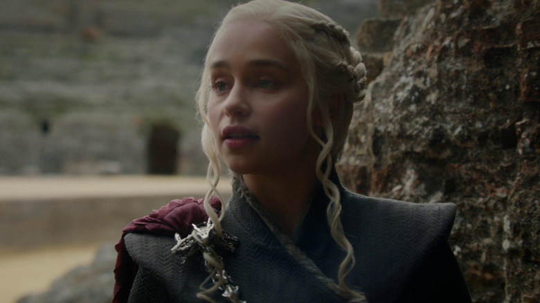 Emilia Clarke as Daenerys standing in the Dragonpit in Game of Thrones