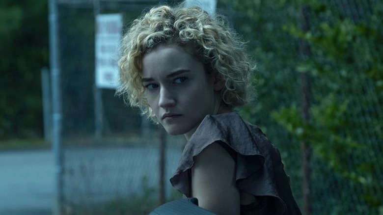 Julia Garner as Ruth looking behind her in Ozark