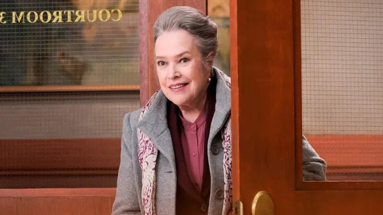 Madeline Kingston (Kathy Bates) enters an office smiling slightly in Matlock (2024)