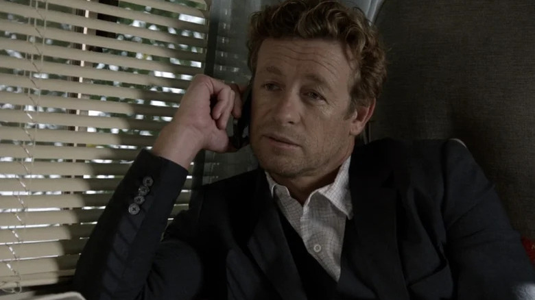 Patrick Jane (Simon Baker) talks on a cellphone in The Mentalist