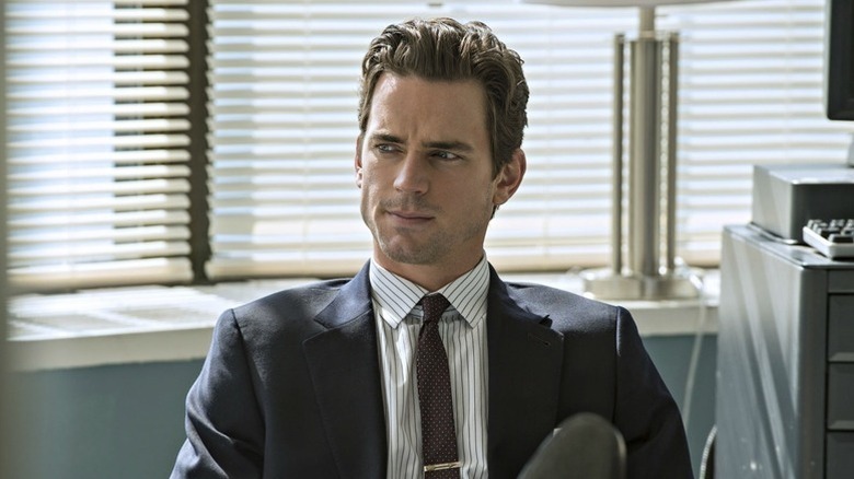 Neal Caffrey (Matthew Bomer) sits pensively in an office in White Collar