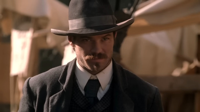 Seth (Timothy Olyphant) in suit looking determined in Deadwood