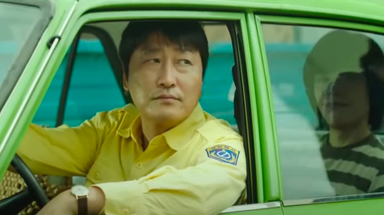 Man-seob looking out of car window