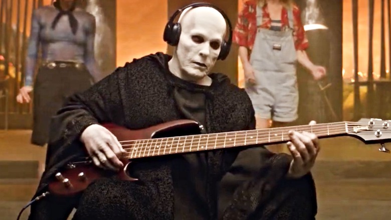 Death plays the guitar