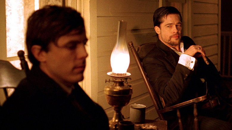 Jesse James (Brad Pitt) stares contemplatively at Robert Ford (Casey Affleck) in The Assassination of Jesse James by the Coward Robert Ford