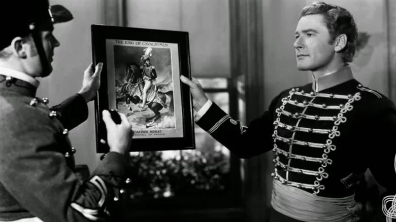 George Armstrong Custer (Errol Flynn) holds a portrait in They Died with Their Boots On