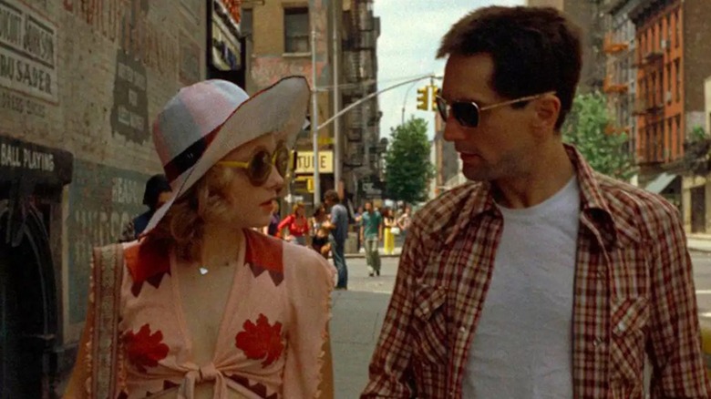 Jodie Foster as Iris Steensma walks down a New York City sidewalk with Robert De Niro as Travis Bickle in Taxi Driver
