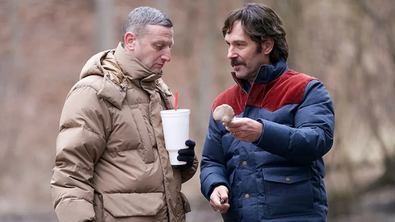 Craig with a big soda and Austin showing him a seashell in Friendship