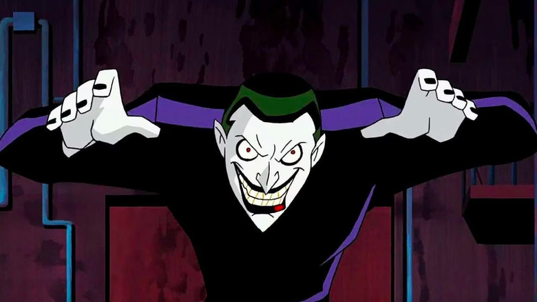 Animated Joker wearing purple and looking menacing with his arms by his head in Batman Beyond: Return of the Joker