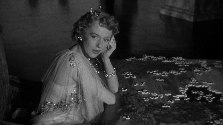 Citizen Kane's Susan Alexander Kane sitting before a jigsaw puzzle