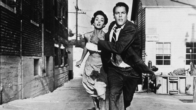 Miles and Becky run from danger