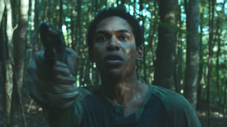 Kelvin Harrison nervously points gun