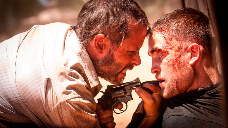 Guy Pearce threatens Robert Pattinson