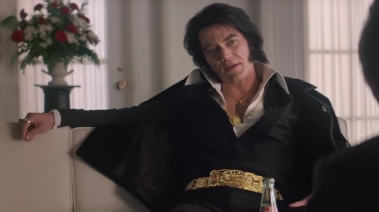 Elvis slouching on a couch