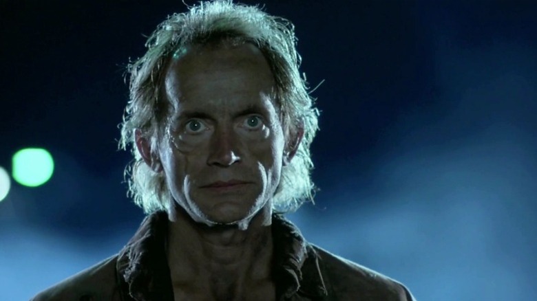Lance Henriksen stares