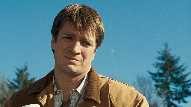 Nathan Fillion winces