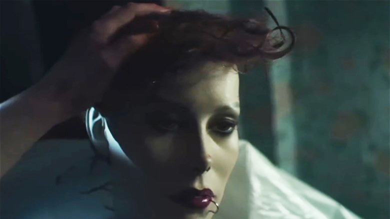 A mannequin wearing a scalp Maniac 