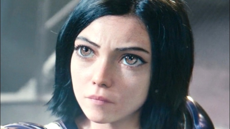Alita looks up at the sky.