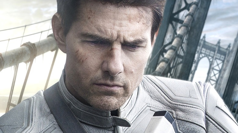 Tom Cruise muses on a bridge