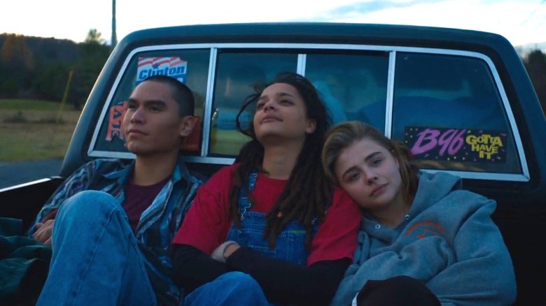 Adam, Jane, and Cameron sitting in the back of a truck in The Miseducation of Cameron Post