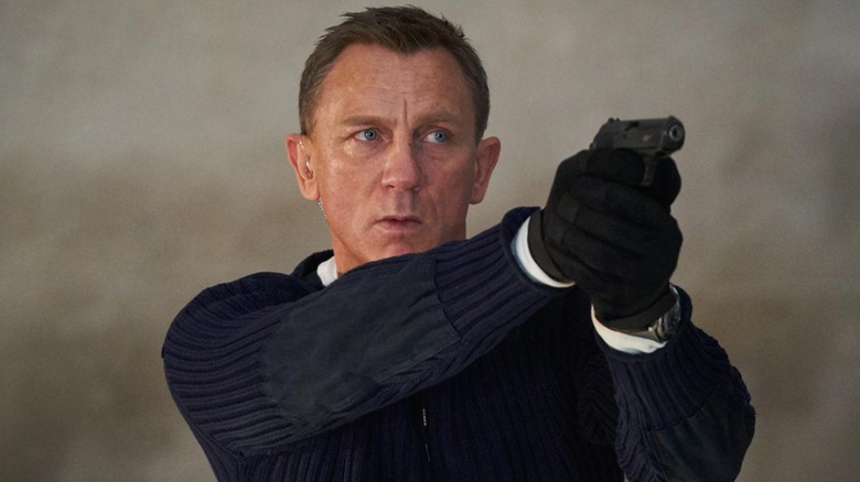 James Bond aiming his gun