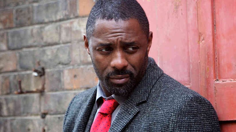 John Luther looking puzzled