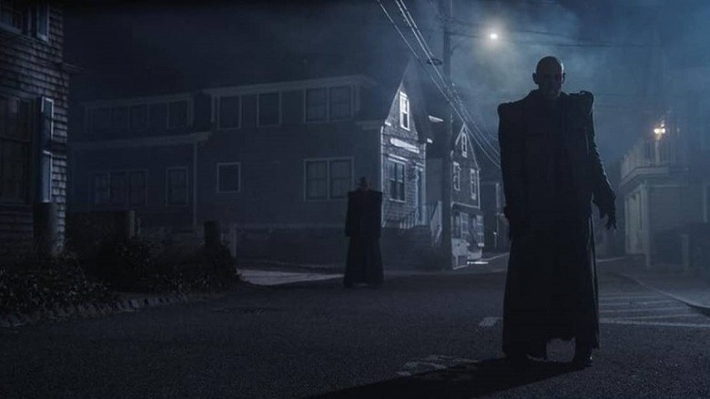 A vampire walks a moonlit street