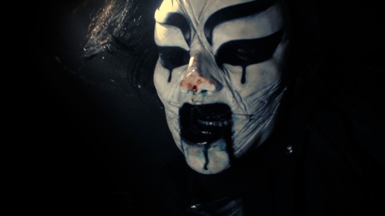 Figure in kabuki mask