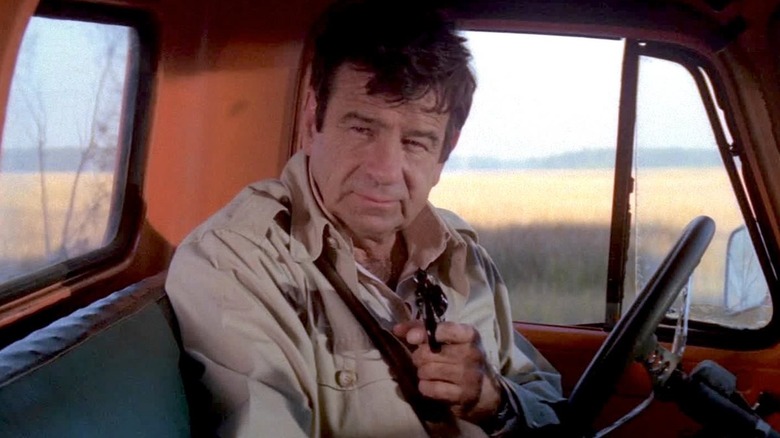Walter Matthau holding a revolver