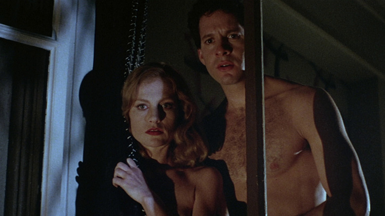 Isabelle Huppert and Steve Guttenberg at the window