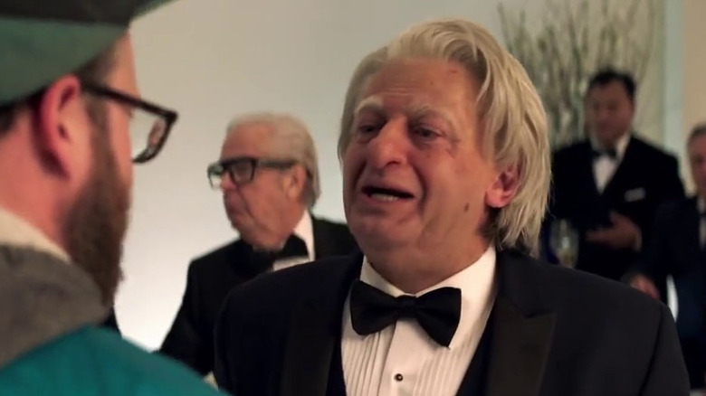 Andy Serkis as Parker Wembley smiling in Long Shot