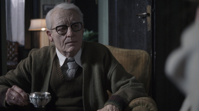 Tilda Swinton as Dr. Klemperer drinking in Suspiria