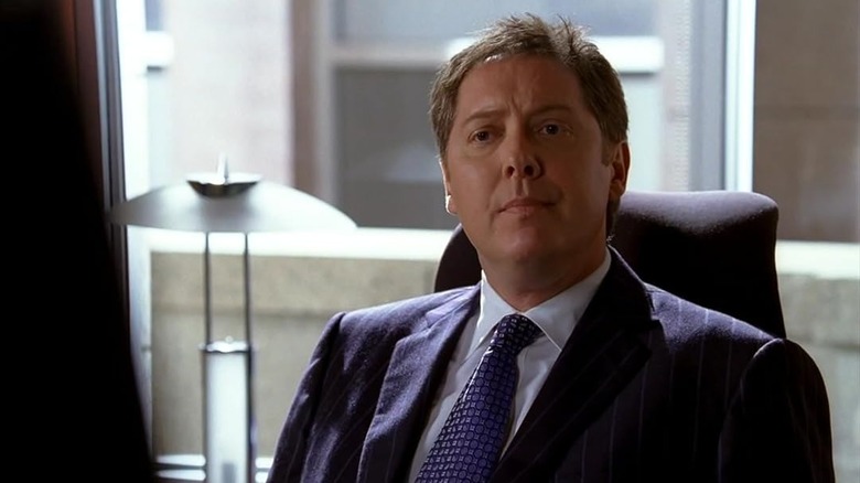 James Spader sitting in blue suit as Alan Shore in Boston Legal