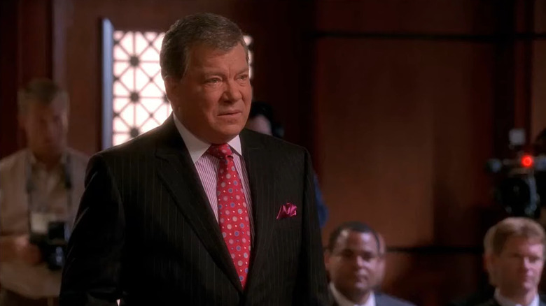 William Shatner in suit and red tie as Denny Crane in Boston Legal