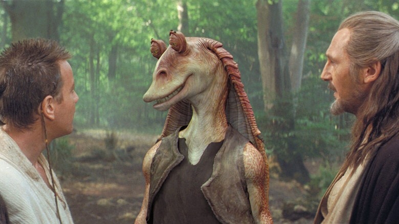 Ahmed Best's Jar Jar Binks meets Ewan McGregor's Obi-Wan Kenobi and Liam Neeson's Qui-Gon Jinn in Star Wars Episode I: The Phantom Menace