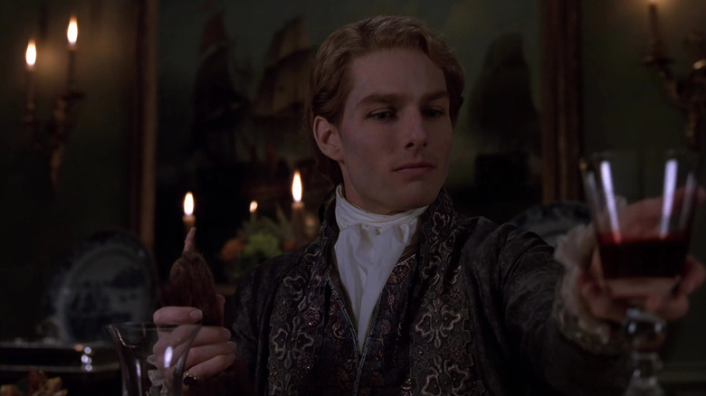Tom Cruise as Lestat enjoys a glass of blood in Interview with the Vampire