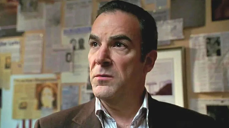 Jason Gideon (Mandy Patinkin) next to newspaper clippings on Criminal Minds