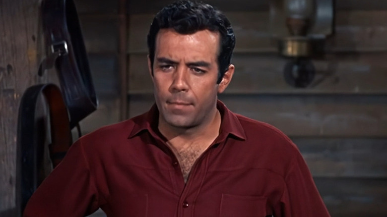 Adam Cartwright (Pernell Roberts) standing in a saloon on Bonanza