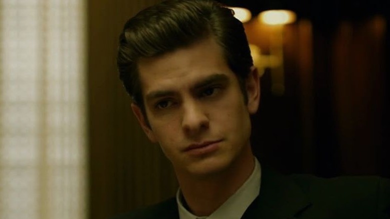 Andrew Garfield as Eduardo Saverin wearing a suit in The Social Network