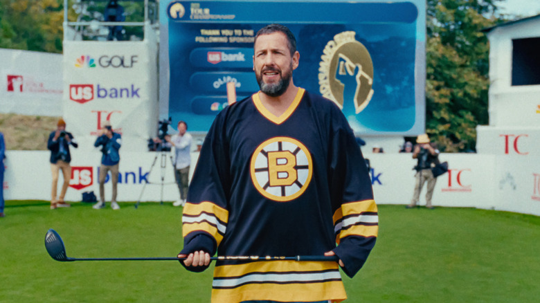 Adam Sandler as Happy Gilmore holds a golf club in Happy Gilmore 2