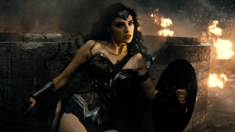 Gal Gadot as Wonder Woman slammed against a wall in Batman v Superman: Dawn of Justice