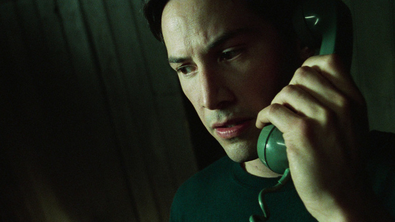 Keanu Reeves as Neo on the phone in The Matrix