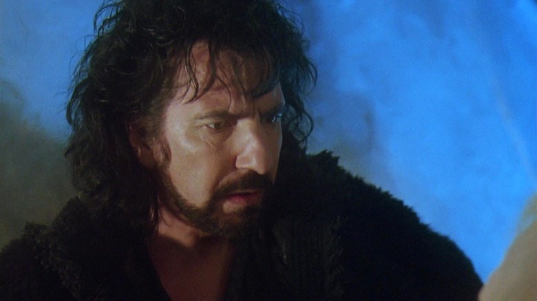 Alan Rickman as the Sheriff of Nottingham looking concerned in Robin Hood: Prince of Thieves