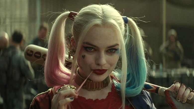 Margot Robbie as Harley Quinn playing with her chewing gum in Suicide Squad