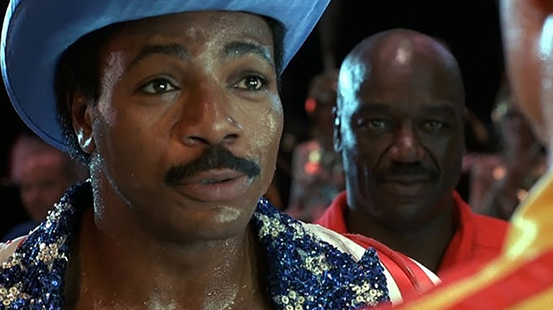 Carl Weathers as Apollo Creed ready to face Dolph Lundgren as Ivan Drago in the ring in Rocky IV.